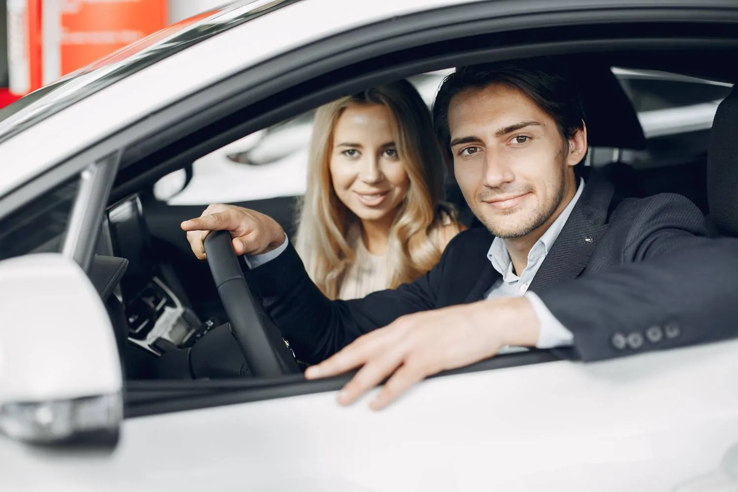 Driver reviewing car coverage details at a desk